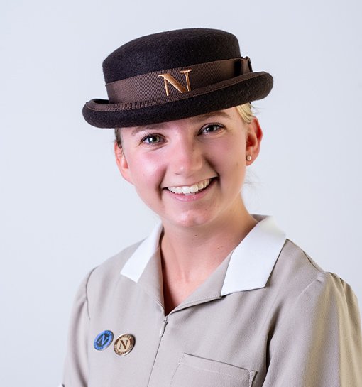 female headshot in Norland nanny uniform