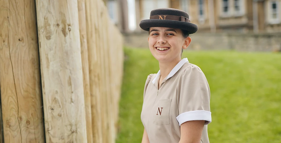 female headshot in Norland nanny uniform