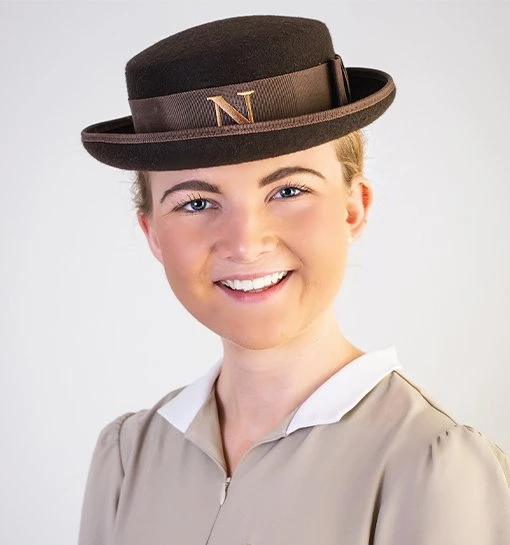 female headshot in Norland nanny uniform