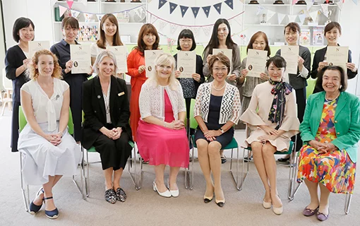 group of ladies posing for photograph holding certificates