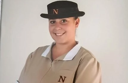 female headshot in Norland nanny uniform