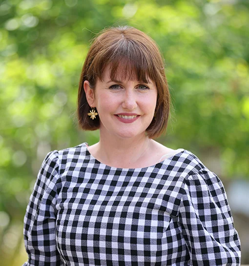 Kat Aveyard, Library Manager at Norland, stood smiling outside
