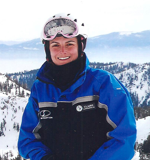 female ski instructor on top of mountain