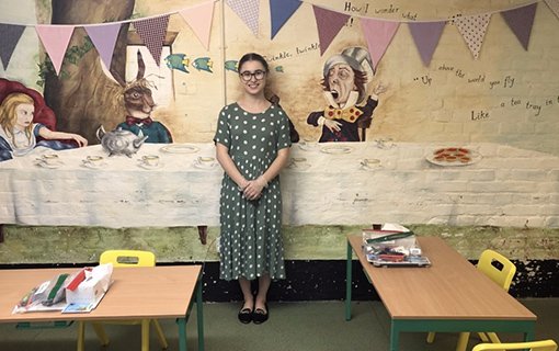 a student stood in a prep school classroom