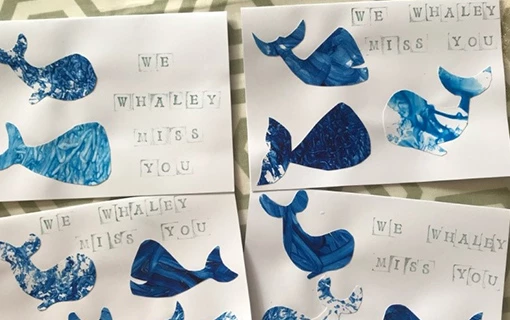 some homemade cards with a picture of a whale painted on it