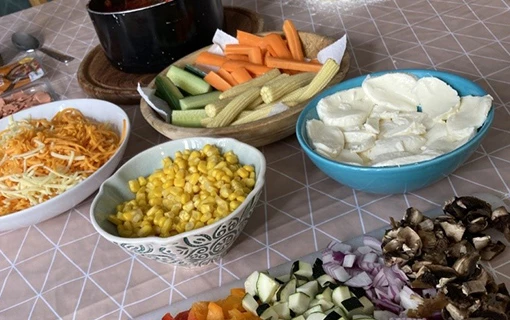 bowls of ingredients for some homemade pizzas