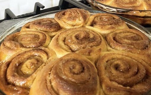 a tray of sourdough cinnamon rolls cooked by a Norland student