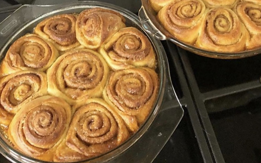 A dish with some sourdough cinnamon rolls that have just been baked