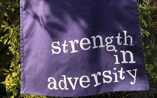 a bag made by a student with the Norland motto 'Strength in Adversity' printed on it