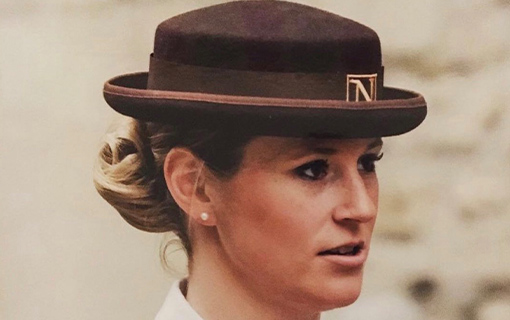 A female student in her formal Norland uniform