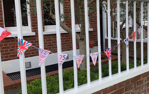 homemade bunting along a fence
