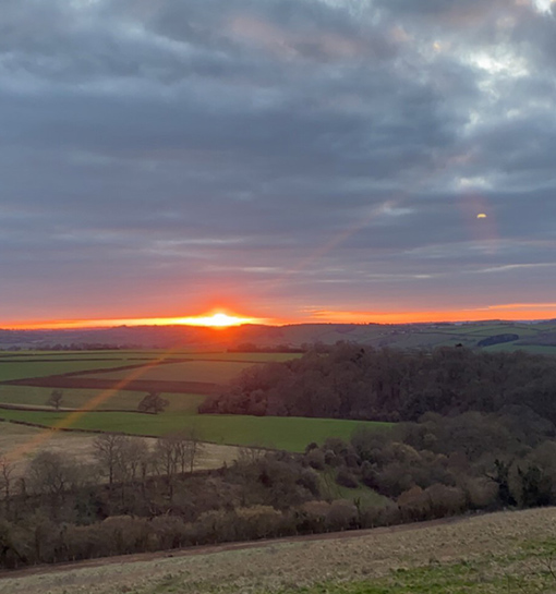 a sunset in the countryside