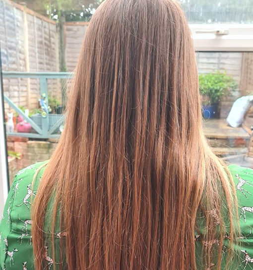 a lady with long hair before she has it cut for charity