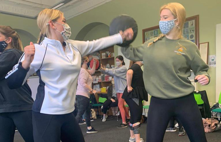 two students participating in self defence