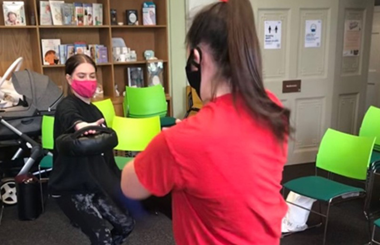 two students participating in self defence