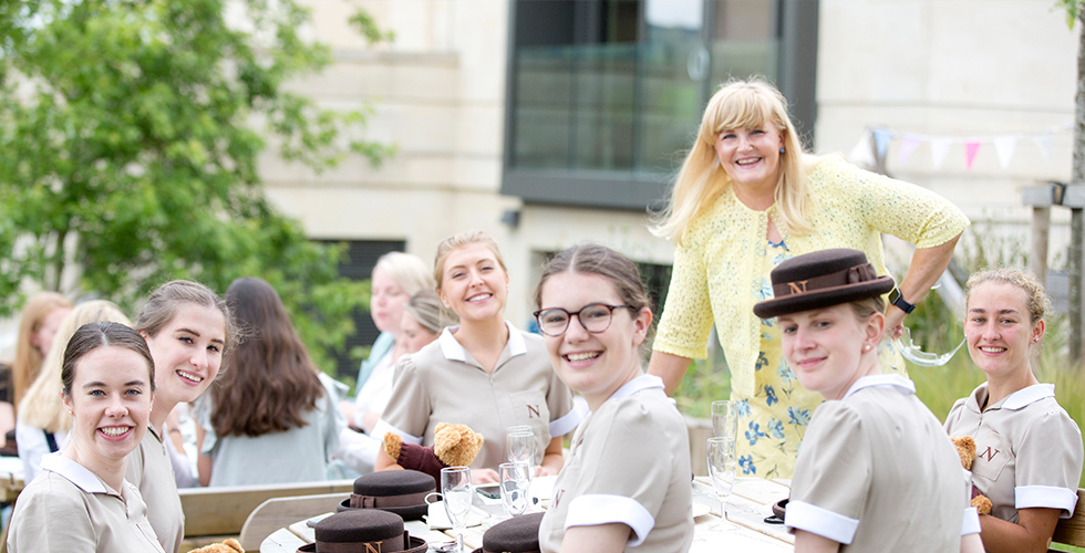 students outside smiling with the principal