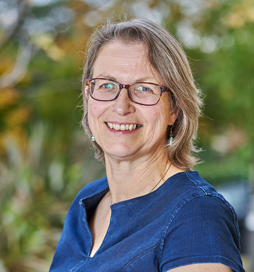 Viki Bennett Kane, Principal Lecturer at Norland, smiling in a garden