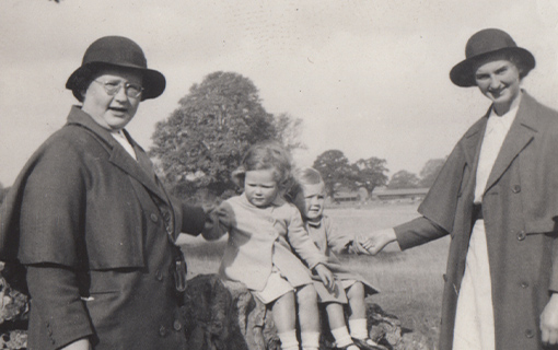 a black and white photo of two nannies