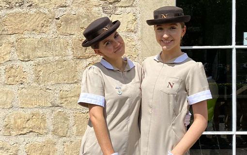 two female Norland students stood smiling