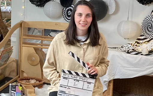 a female holding a clapper board