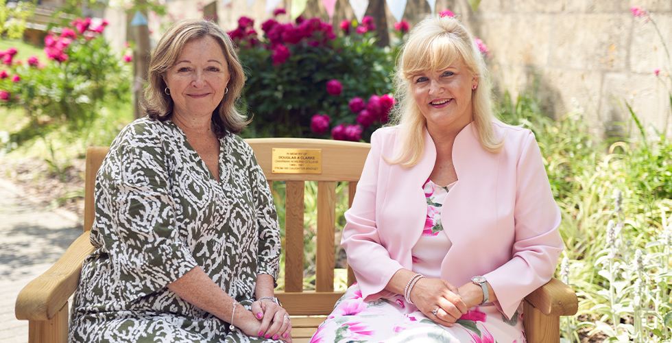 Dr Janet Rose and Mandy Edmond, Principal and Vice Principal of Norland, sat on a bench