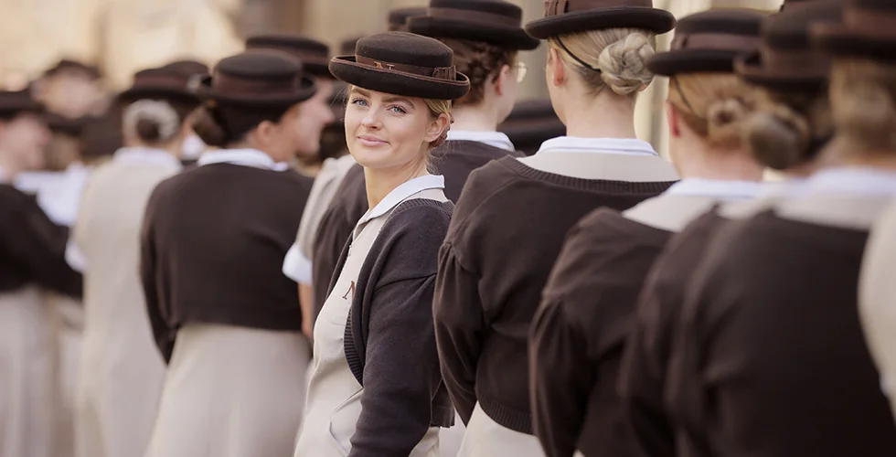 A female Norland Nanny at her graduation ceremony at Bath Abbey