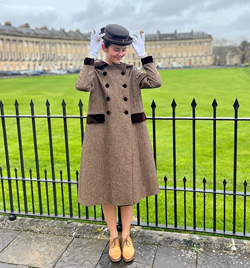 A Norland student in uniform stood in front of the Royal Crescent in Bath