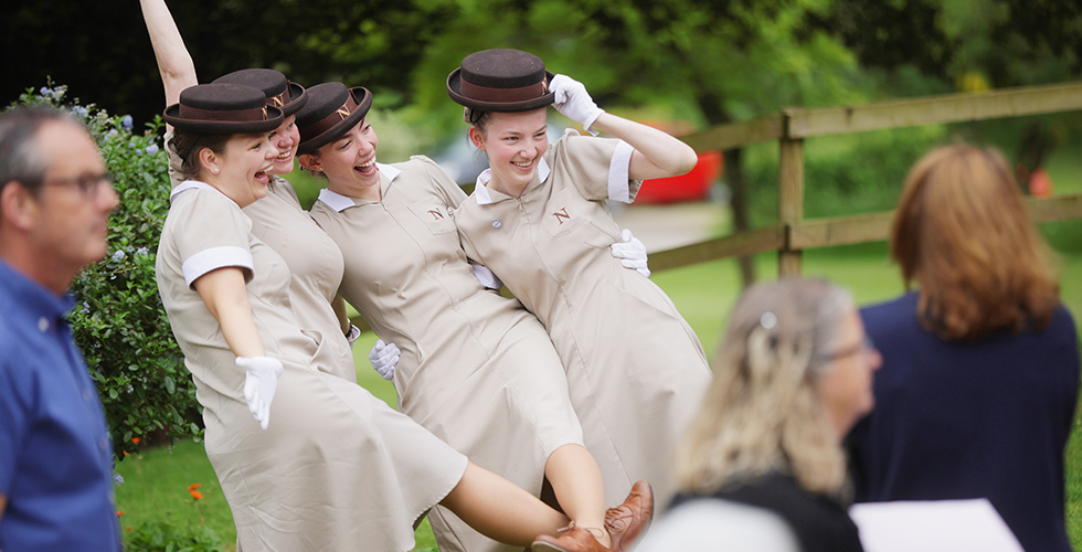 Norland students posing for a photo in uniform