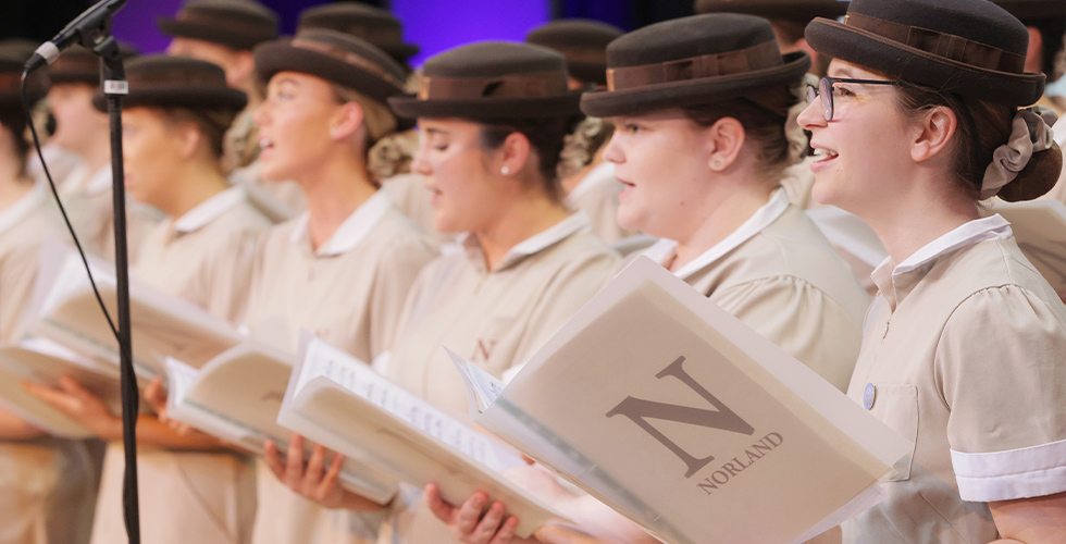 Norland choir on stage performing