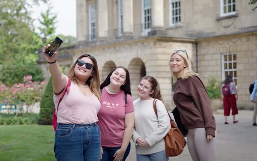 Four females in the Holbourne Museum gardens taking a selfie