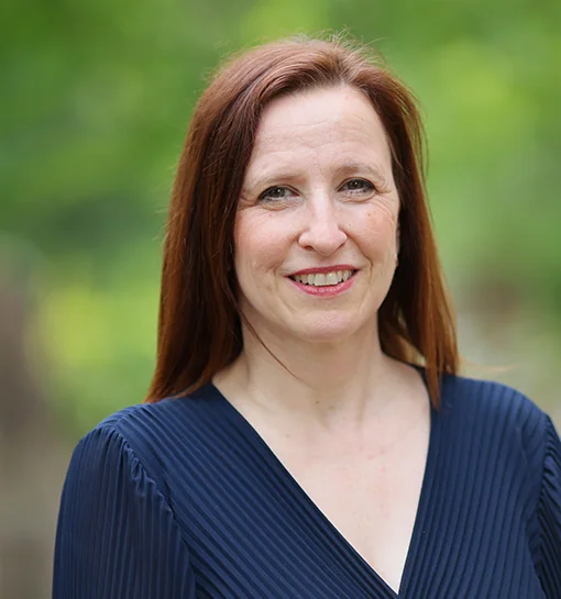 Dr Lisa Gentle, Research Manager/Fellow at Norland, stood outside smiling