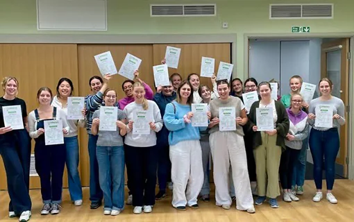 Norland students holding up first aid certificates in celebration