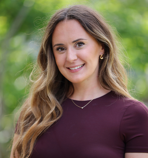 Tilly Alderton, Marketing Events, Design and Brand Manager at Norland, stood outside smiling