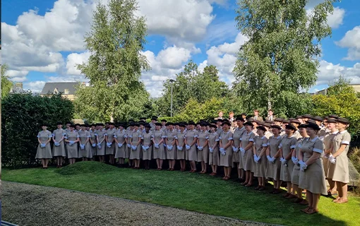 A group of Norland students having a group photo in their formal uniform