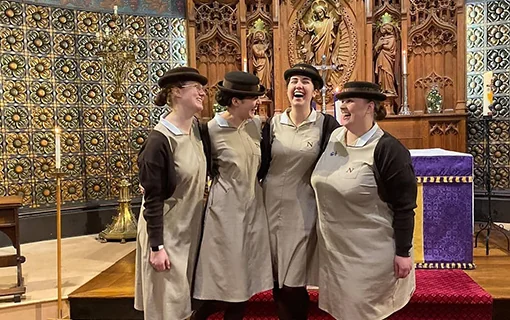 Norland students in uniform in front of church