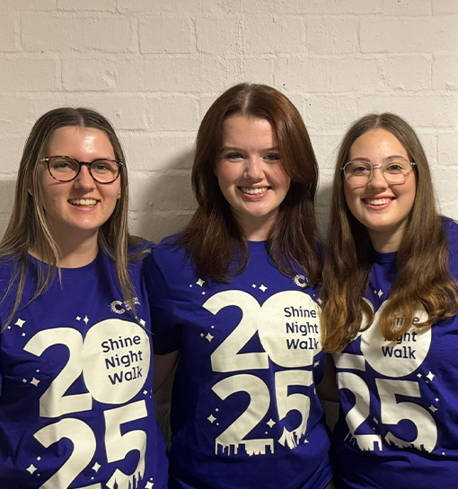 Three females smiling