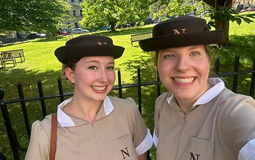 Students in uniform smiling to camera