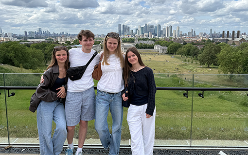 Students smiling in group picture at viewpoint