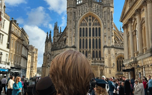 Back of head image of student in front of Bath Abbey