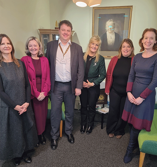 Senior staff members pose for photo with Department for Education Head at Norland campus