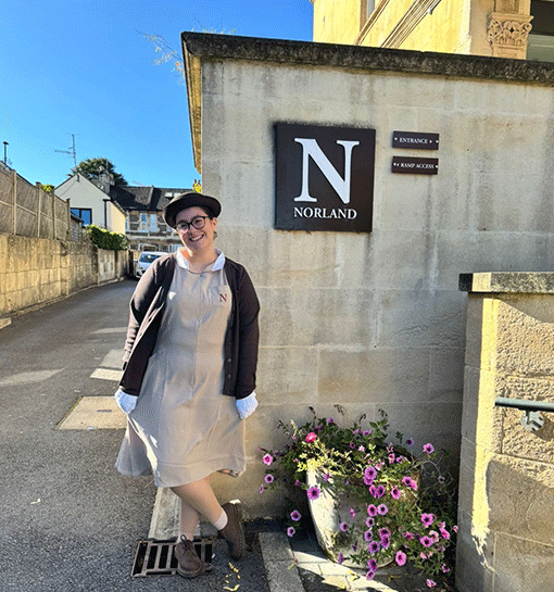 Student Mia smiling outside of Norland campus building