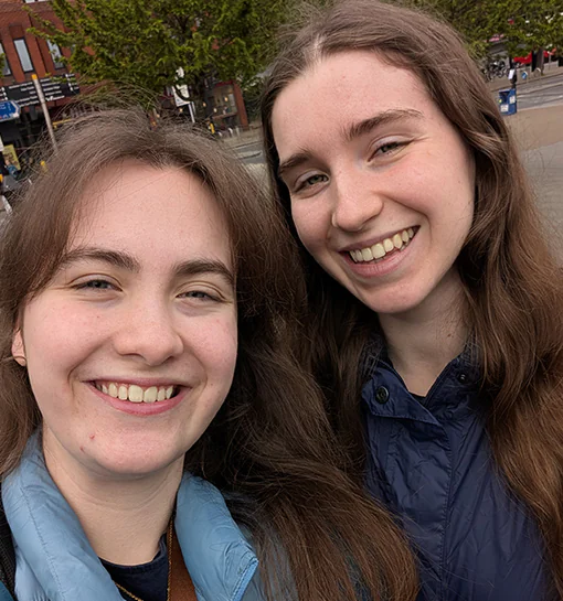 Two females smiling