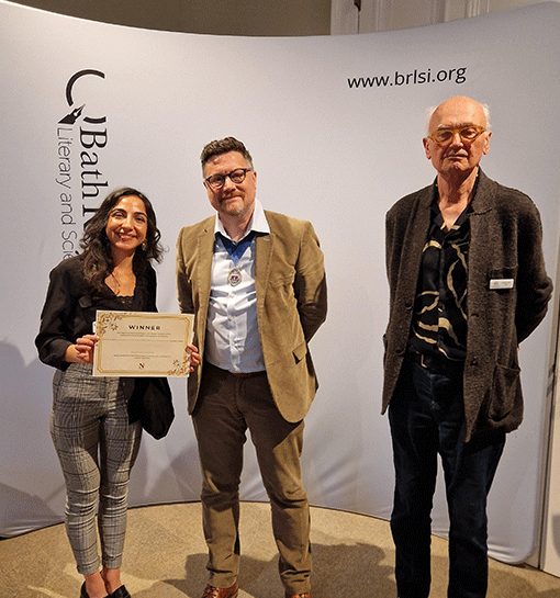 Student award winner with certificate