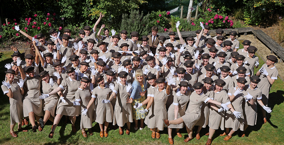 Norland Set 147 students in uniform taking silly picture of whole set