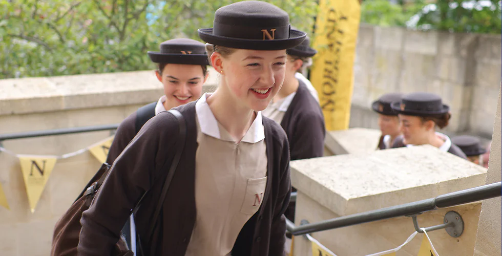 First-year students walking into Norland University of Early Childhood in their formal Norland Nanny uniform on their first day