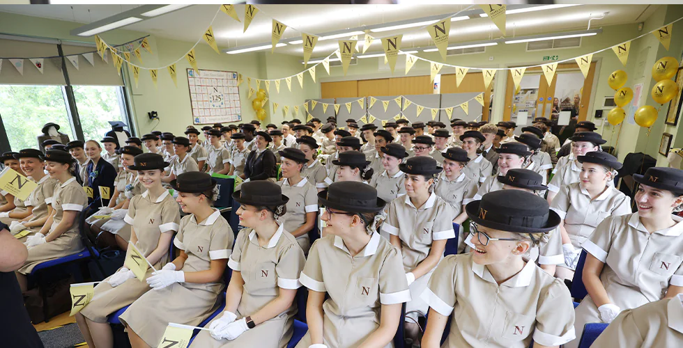 Set 150, first-year students at Norland University of Early Childhood, sat in a hall on their first day