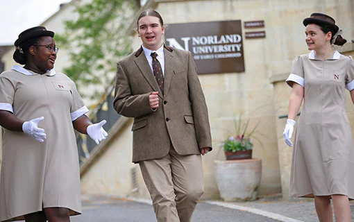 Norland University first-year students walking at the Oldfield Park campus in Bath