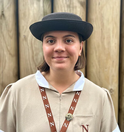 Nyah, a second-year international student at Norland University, stood in her formal uniform